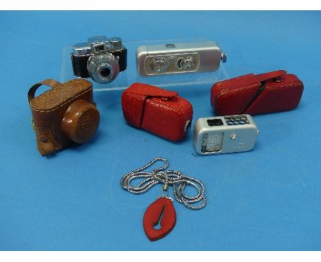 A German Minox Wetzlar subminiature 'Spy' camera, and Minox exposure meter, silver, with red leather slip cases, together wit