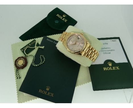 Rolex: A gentleman's 18ct gold Rolex Oyster Perpetual Day-Date Wristwatch, the circular face with fluted bezel, enclosing cha