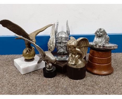 A Rover Viking mascot, on a wooden base, 12 cm high, and others similar  Please see our terms and conditions in relation to c