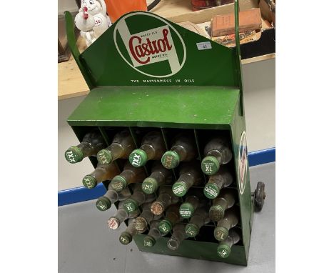 A Castrol Wakefield Motor Oil forecourt dispenser, with various bottles, some with contents, 49.5 cm wide  Please see our ter