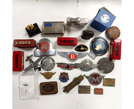 Assorted car badges, spark plug tin boxes and other items  Please see our terms and conditions in relation to collection