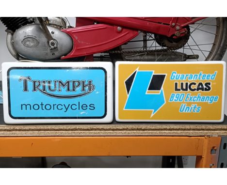 A Triumph Motorcycles lightbox, 36 cm wide, and a Lucas Guaranteed B90 Exchange Units lightbox, 36 cm wide (2)  Please see ou
