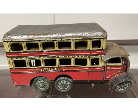 A tin plate clockwork General double decker bus, 17 cm high  Please see our terms and conditions in relation to collection