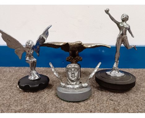 A chrome plated car mascot, in the form of a butterfly lady, on a radiator cap, 12.5 cm high, and three others similar (4)  P