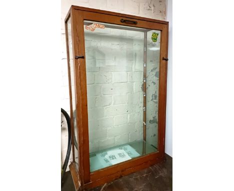 A small oak framed shop display cabinet, 55 cm wide x 21 cm deep x 80 cm high  Please see our terms and conditions in relatio