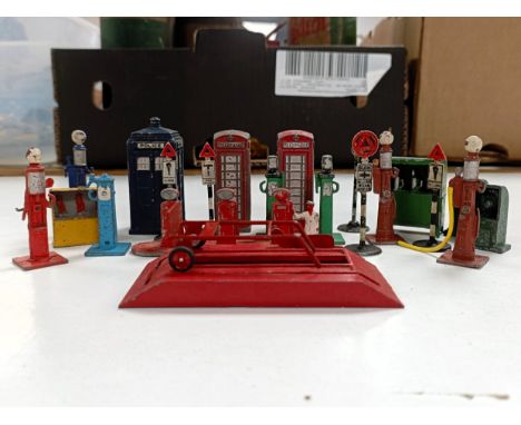 Assorted Dinky and other petrol pumps, telephone boxes and other items  Please see our terms and conditions in relation to co