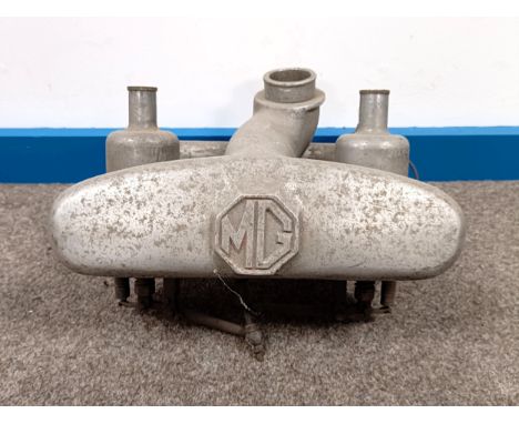 A pair of twin carburettors, with an MG manifold  Please see our terms and conditions in relation to collection