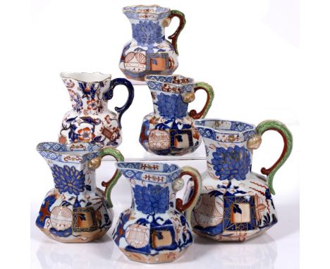 A group of six Davenport stone china jugs largest 14cm