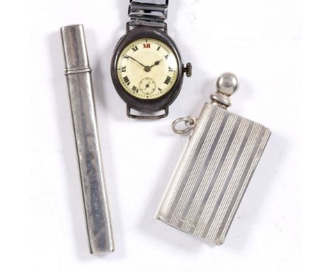 A silver mounted wrist watch a pair of cased silver scissors and a silver vesta with engine turned decoration