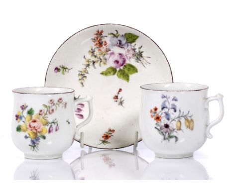 Two Chelsea porcelain cups of bell shape painted with flowers and a similar saucer (3) Provenance - Aurea Carter.