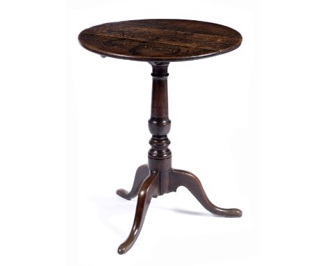 A George III oak circular occasional table  on tripod supports, 58cm across 