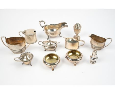A collection of silver to include silver sauceboat, two handled sugar basin, cream jug and various cruet pieces