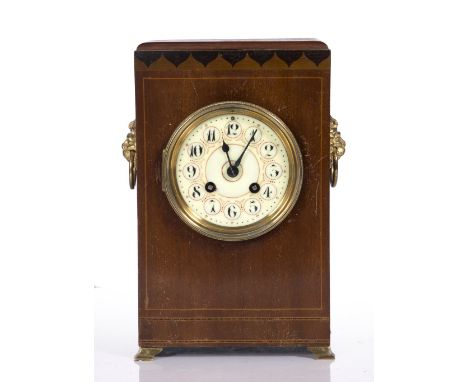 An Edwardian mahogany mantel clock of square cut form with two train movement
