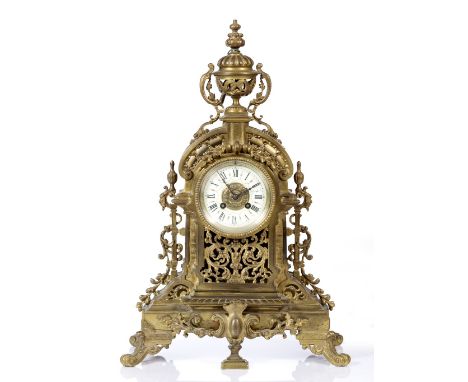 A Victorian brass mantel clock with enamel dial and striking movement, 53cm high