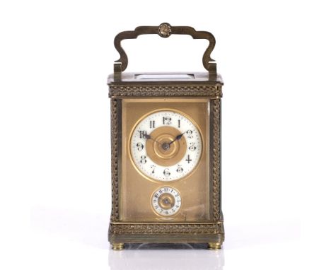 A French brass carriage clock with gilt and enamel dial, and alarm mechanism