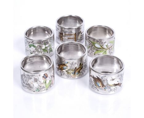A set of six Victorian silver napkin rings with enamel decoration with birds and flowers etc, London 1884