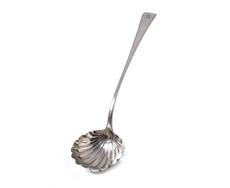 A silver ladle with scallop shaped bowl , feather edge and engraved crest,London 1760 , makers William Sumner and Richard Cro