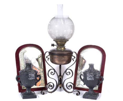 An Art Nouveau copper lamp a pair of plaster urns and a pair of Victorian velvet and etched glass mirrors