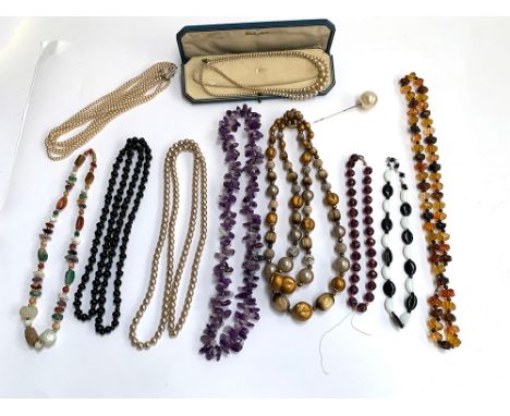 A quantity of costume jewellery to include hardstone necklaces, amethyst necklace etc; together with quantity of faux pearl n