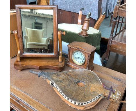 A small 19th century mahogany adjustable dressing mirror; together with an oak mantel clock, and a set of bellows 