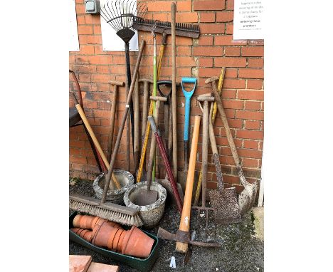 A quantity of vintage tools, together with a terracotta pots and two composite stone planters 