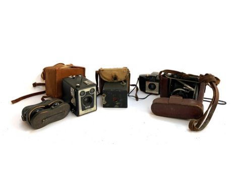A mixed lot to include a Kodak box camera; Kodak Brownie Six-20 model D; together with one other; Kodak Brownie 127; cased se