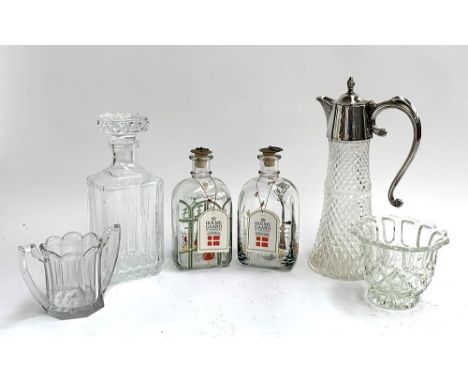 Two Holme Gaard rounded rectangular Christmas decanters, together with a square decanter, plated and glass claret jug, etc 