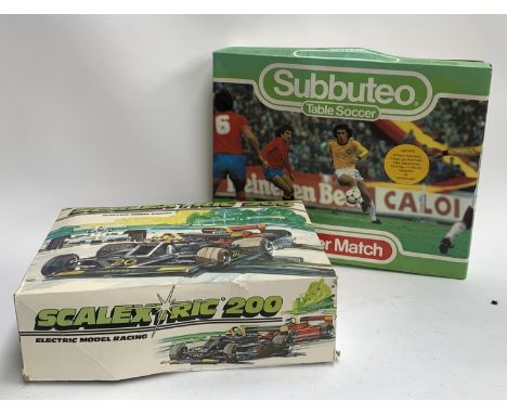 A boxed Subbuteo set together with a boxed Scalextric 200 set 