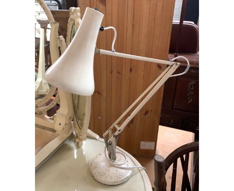 A white anglepoise lamp 