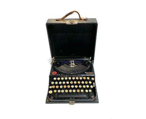 A Smith Premier Typewriter Co. typewriter sold by Remington Portable 
