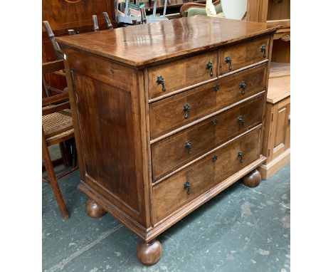 A basically Georgian and later walnut chest of two short over three graduating drawers, quartered and crossbanded top, on lat