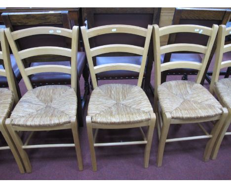 A Set of Six Rush Seated Light Wood Kitchen Chairs.