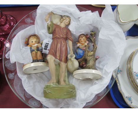 Royal Dux Figure of Water Carrier, in traditional pastel colours, 24.5cm high. Two Hummel figures, a Chance glass dish.