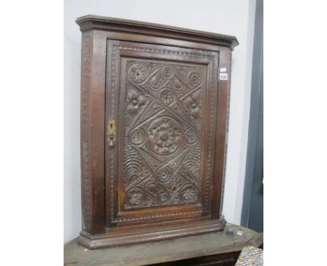 A XIX Century Carved Flat Fronted Corner Cupboard, with one internal shelf.