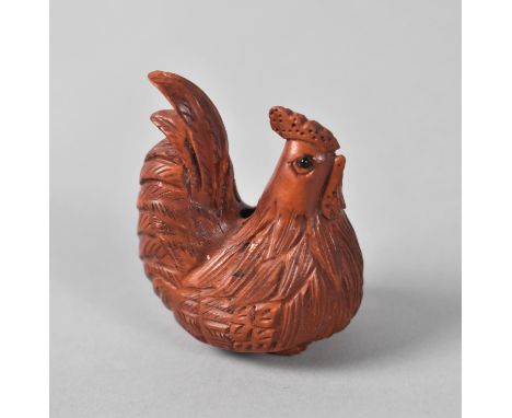 A Small Carved Wooden Netsuke in the Form of a Chicken 