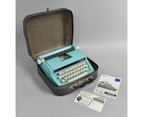 A Vintage Petite Deluxe Junior Typewriter in Carry Case 