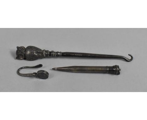 A Silver Handled Novelty Button Hook with Long Eared Owl, Silver Skirt Lifter, and a Propelling Pencil 