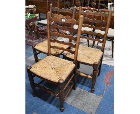 A Set of Three Rush Seated Oak Ladder Back Chairs 