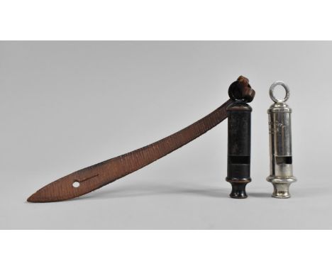 An Army Whistle with War Department Stamp and an Acme City Whistle 