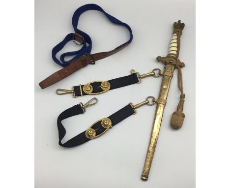 A WW2 era German Kriegsmarine officer’s dress dagger, complete with knot and hanging straps, and it’s blue webbing under belt