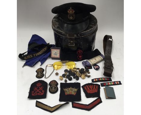 A collection of WW2 Royal Navy badges, buttons, early 20th century scouting items, service cap and other memorabilia associat