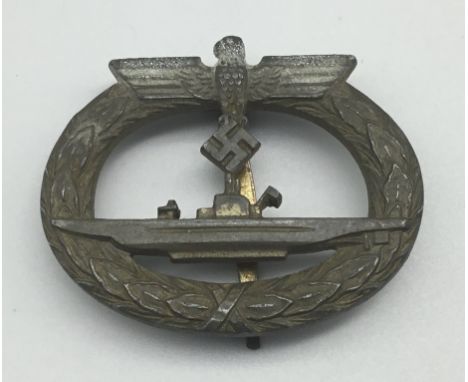 A WW2 German U-Boat badge.An unmarked example, with a gilt finish, ‘coke bottle’ pin and C clasp tothe reverse side.There app