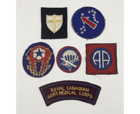 A selection of WW2 British and American embroidered patches. To include: a US Airborne Garrison cap patch, an 82nd Airborne p