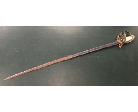 A William IV pipe back sword, with gilt brass guard containing the WR royal cypher and crown.Gilt brass fold down guard, quil