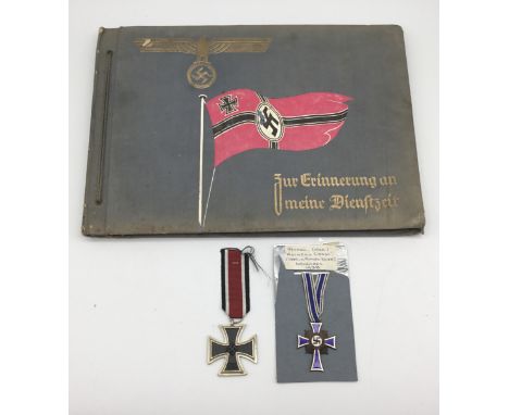 A trio of WW2 German items. To include, a commercially produced Kriegsmarine photograph album, entitled ‘Zur Erinnnerung an M