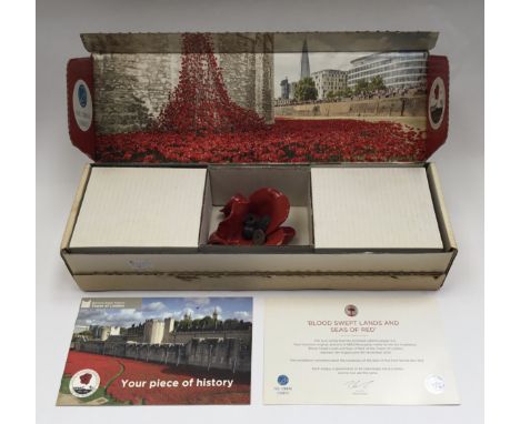 Paul Cummins-  A boxed ceramic poppy. Made for the tower of London in an edition of 888,246 poppies to commemorate the centen