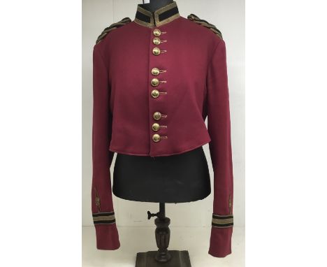 An early 20th century military style bandsman’s tunic, and original early 20th century display mannequin. Manufactured by ‘Un