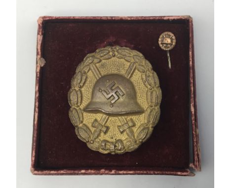 A scarce gold grade Spanish Civil War Condor Legion wound badge, by K.Wagner, Berlin 14. Complete with case of issue, and a m