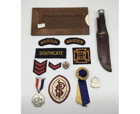 A selection of WW2 Civil Defence / ARP related badges and other items. To include: a late WW2 nickel ARP wardens badge, with 