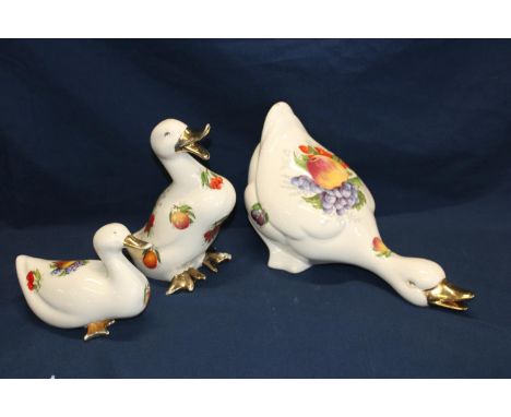 Three ceramic duck figures 